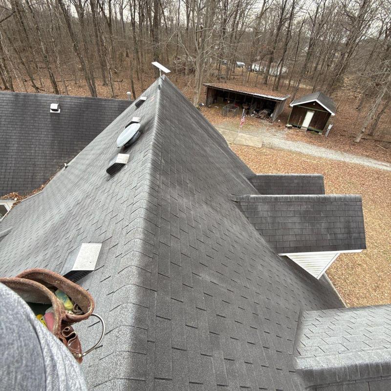 Asphalt shingle roof with ridge vent and flashing inspection