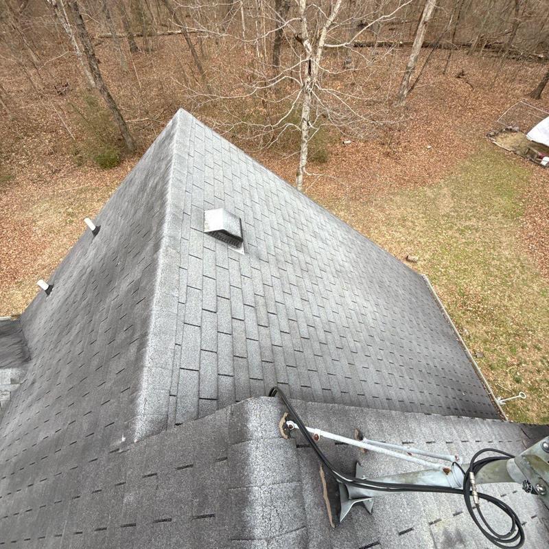 Asphalt shingle roof with vent pipe and antenna mount