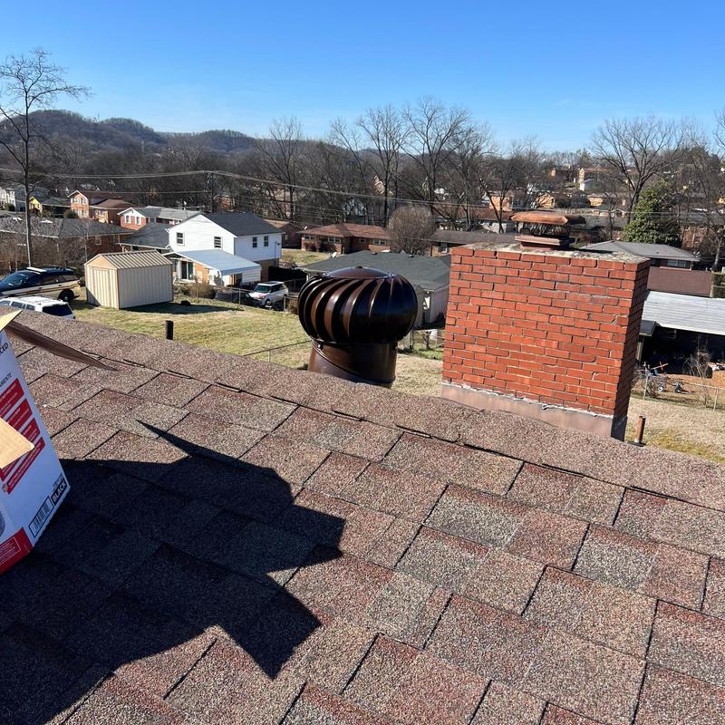 Roof shingles with brick chimney and roof vent turbine