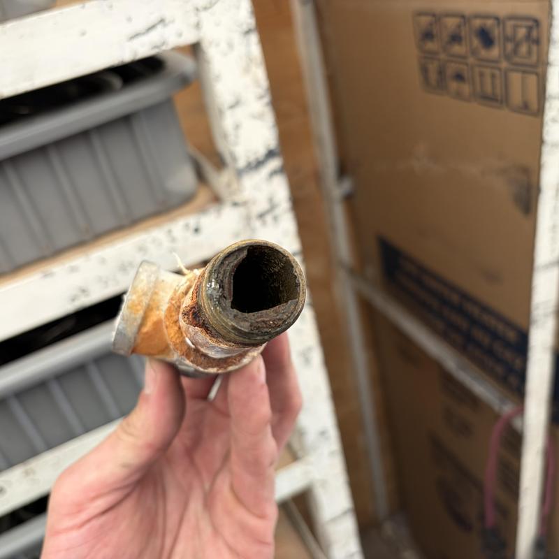Galvanized nipple with rust and corrosion damage Galvanized nipple with rust and corrosion damage