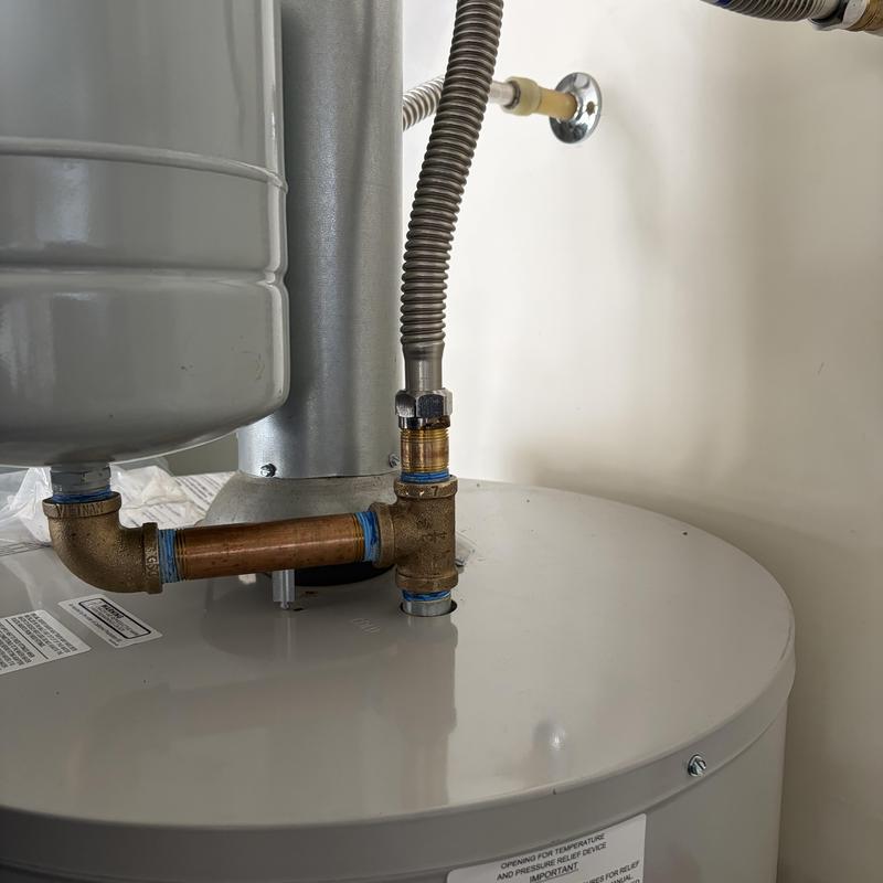 Thermal expansion tank and brass fittings on water heater Thermal expansion tank and brass fittings on water heater