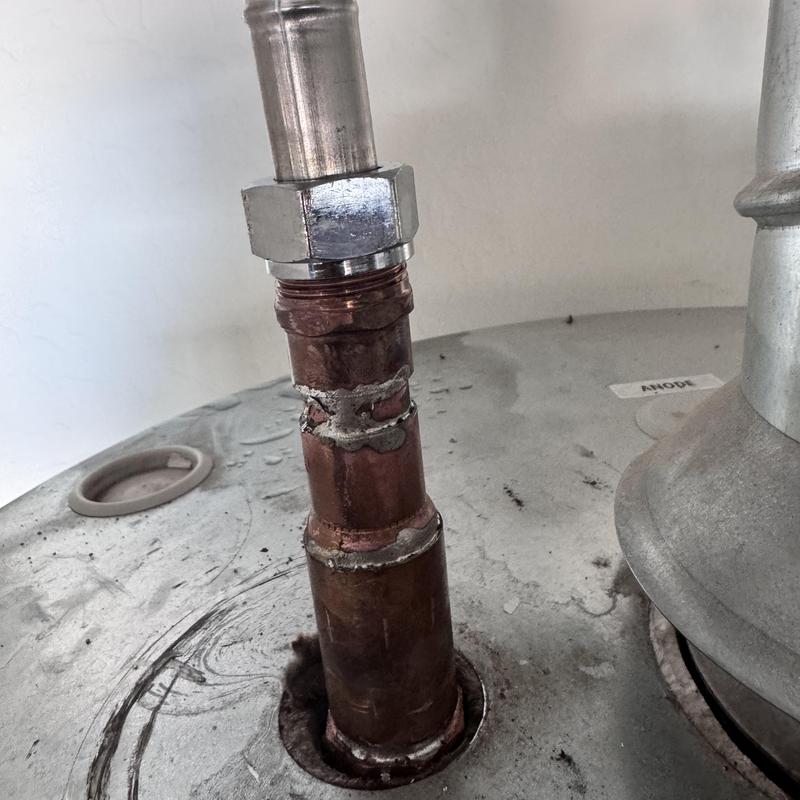 Hot water heater nipple with pipe connection and rust Hot water heater nipple with pipe connection and rust