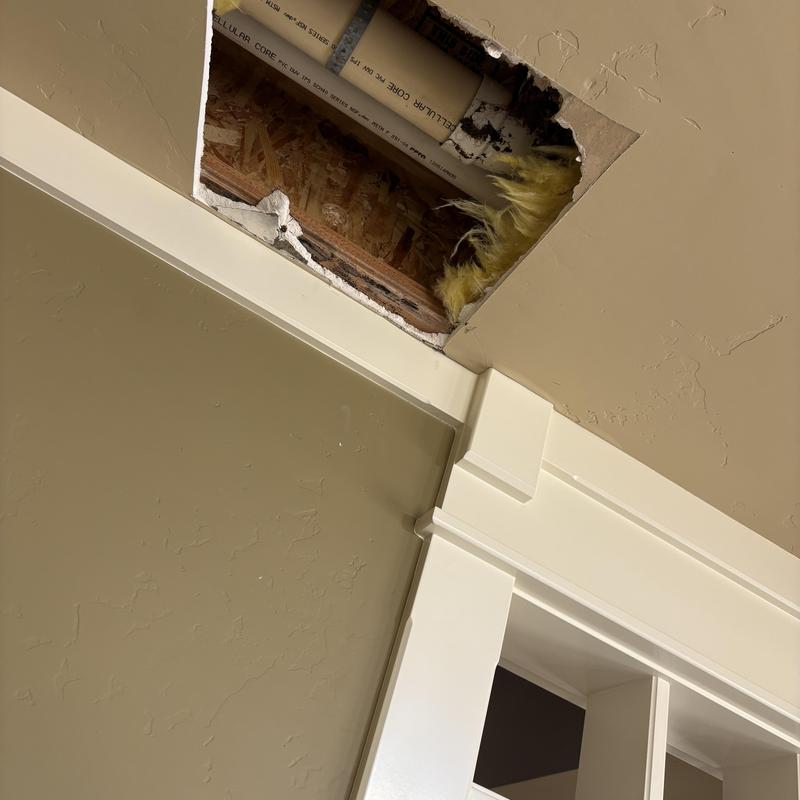 Ceiling with exposed plumbing pipe and insulation Ceiling with exposed plumbing pipe and insulation