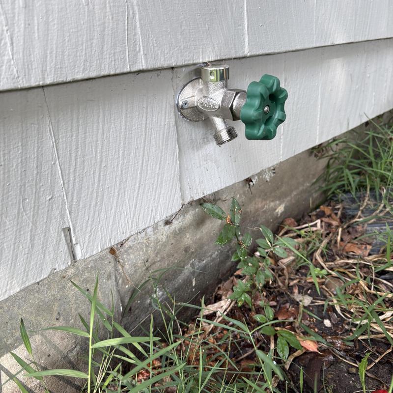 Frost-free outdoor faucet with green handle installation