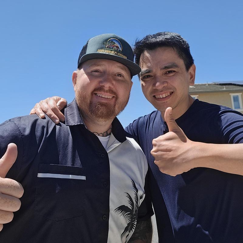 Plumbing fixtures restoration with happy customers outdoors