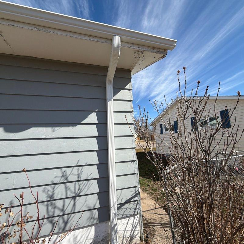 Aluminum downspout and gutter system on house exterior Aluminum downspout and gutter system on house exterior