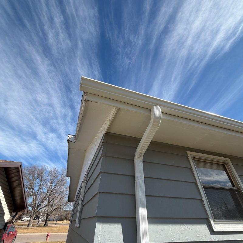 Aluminum gutters and downspout on house exterior Aluminum gutters and downspout on house exterior