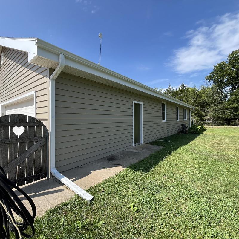 Mastic aluminum gutters on residential building exterior Mastic aluminum gutters on residential building exterior