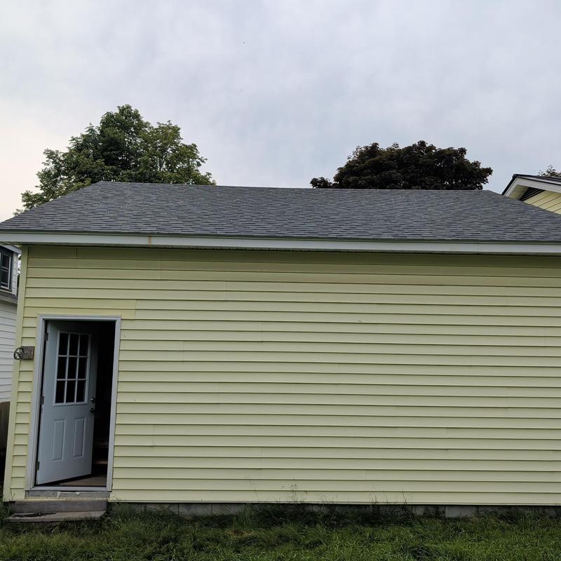 Architectural shingle roof on garage with open door