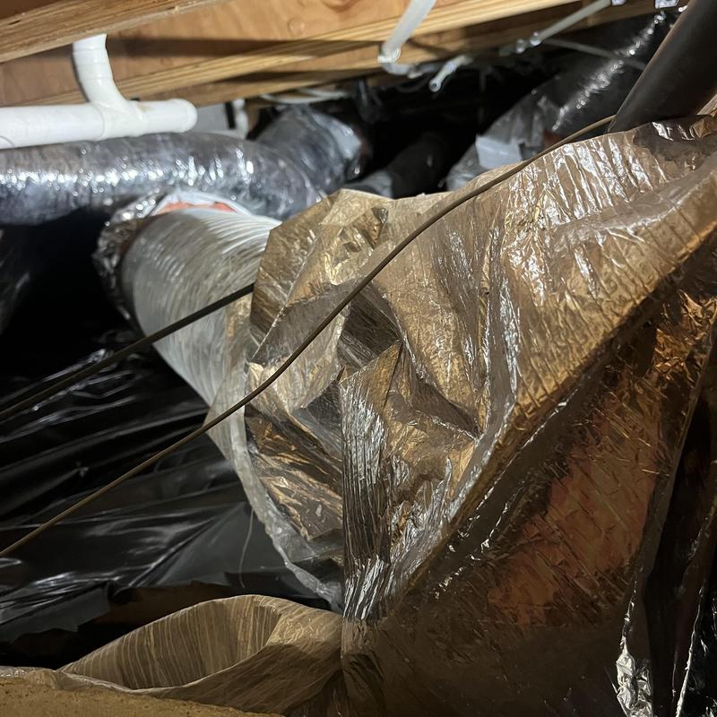 Flood damaged flex HVAC ducting in crawl space