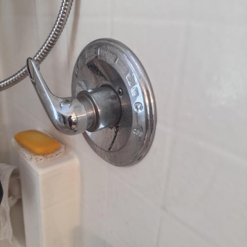 Delta shower valve handle on tiled wall bathroom Delta shower valve handle on tiled wall bathroom