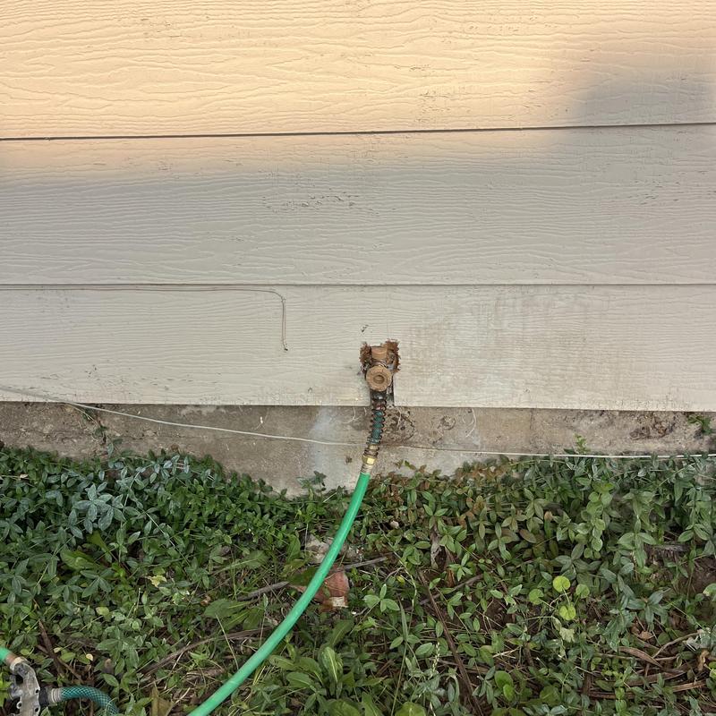 Woodford frost free hose bib with green hose attached