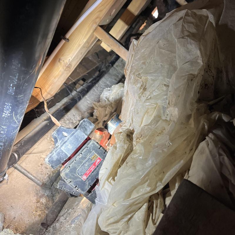2-inch kitchen drain line in crawlspace with strap installation