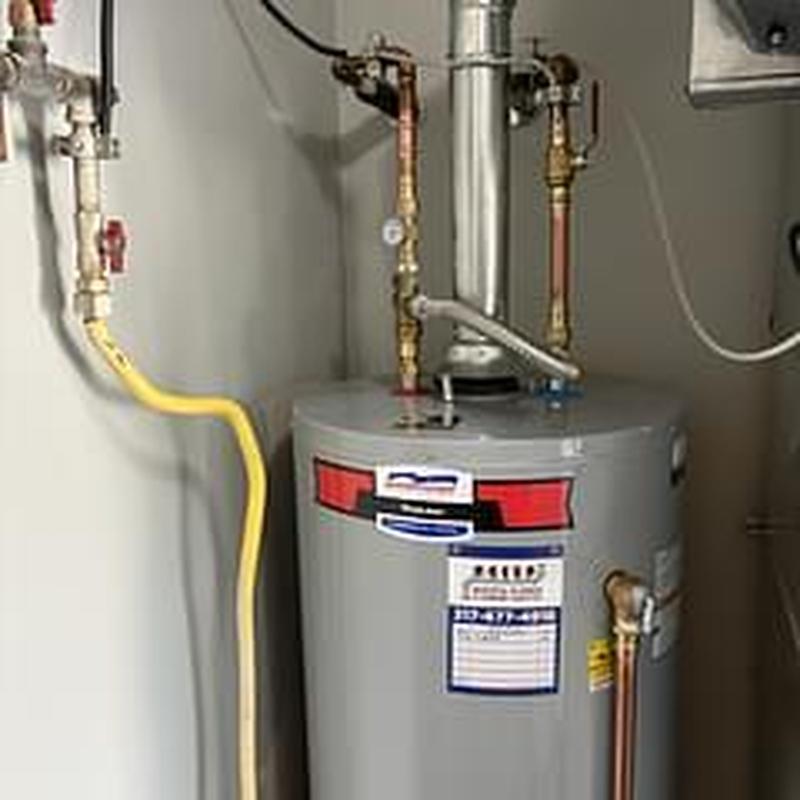 Gas water heater with tank booster installation