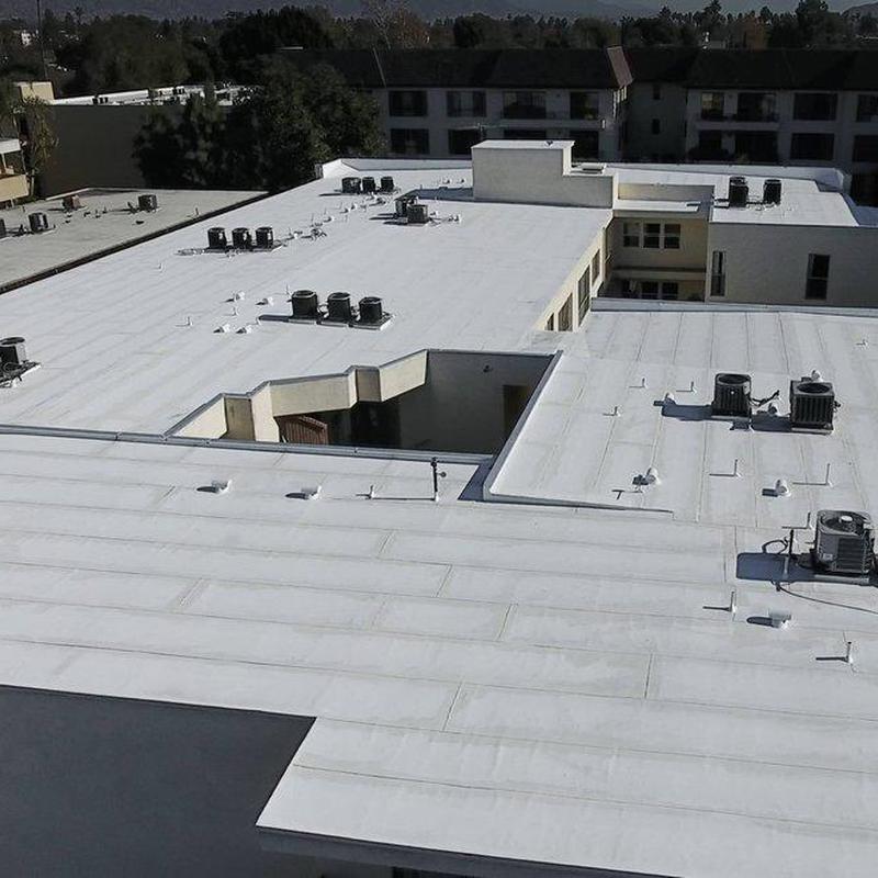 Flat commercial roofing system with HVAC units Flat commercial roofing system with HVAC units