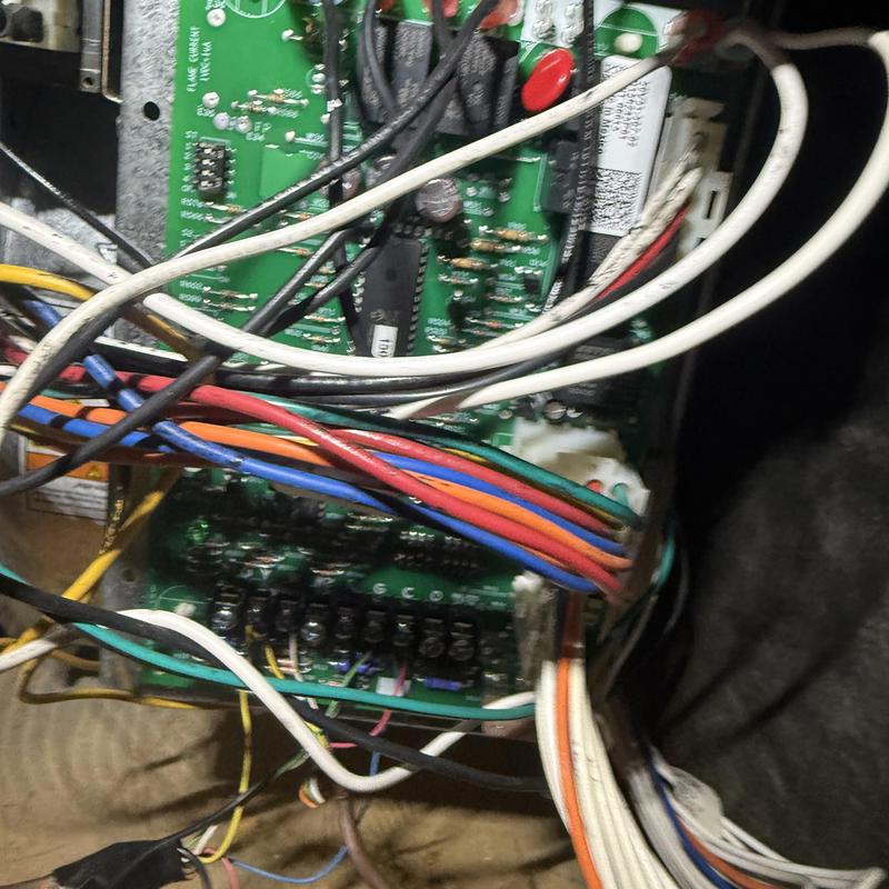 HVAC control board and wiring close-up with colored wires