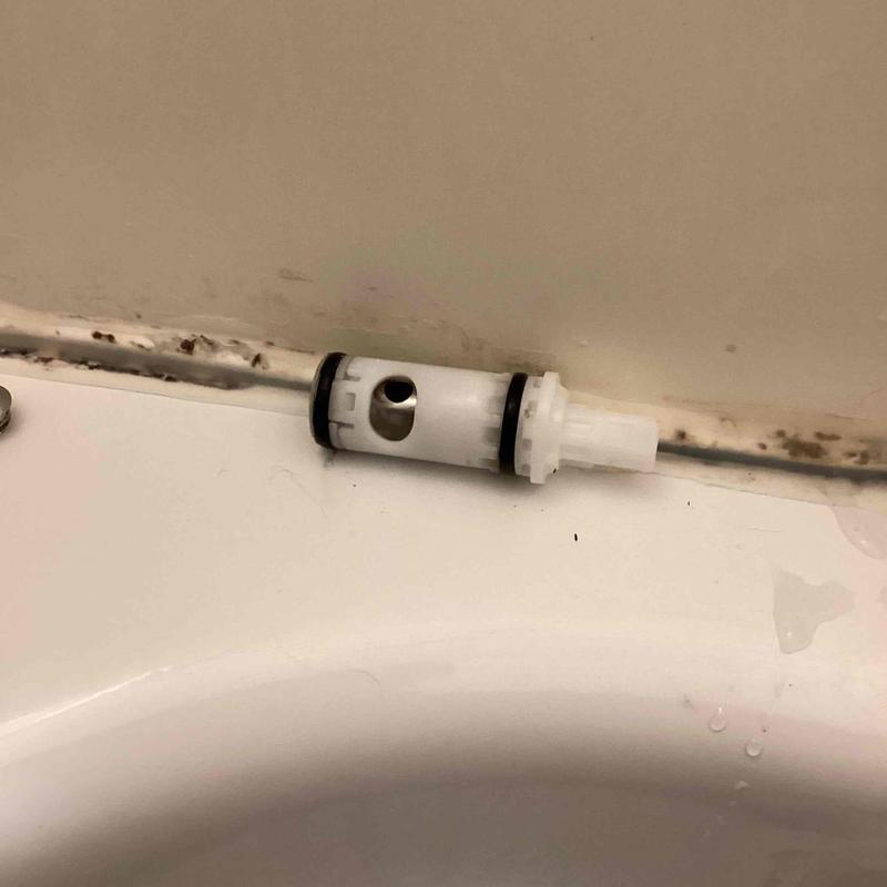 Tub and shower stem installed on tub edge near wall Tub and shower stem installed on tub edge near wall