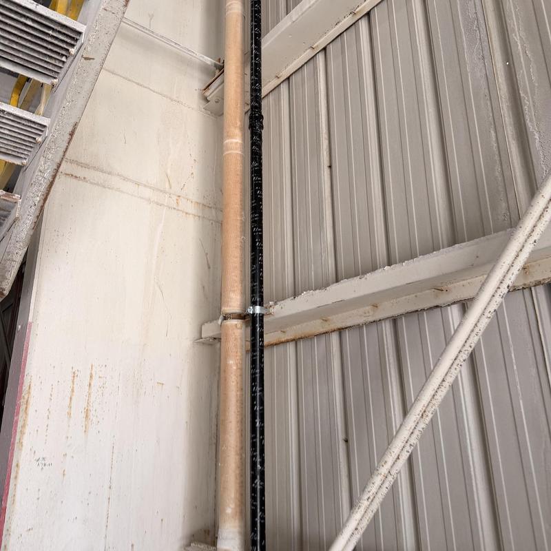 Overhead pressure sewer line with galvanized piping