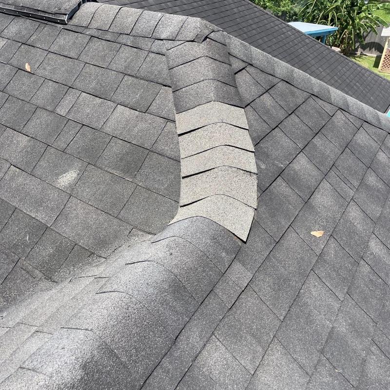 Asphalt shingle ridge cap with repair sections