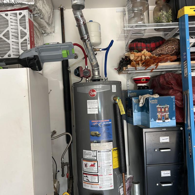 Water heater check valve and piping in utility room Water heater check valve and piping in utility room