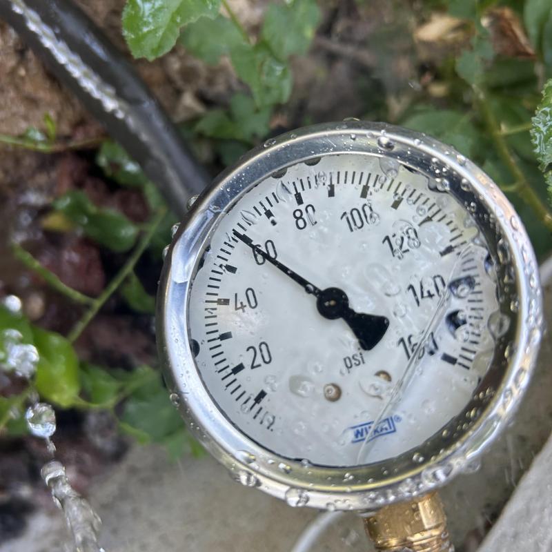 Water heater pressure gauge with water droplets Water heater pressure gauge with water droplets