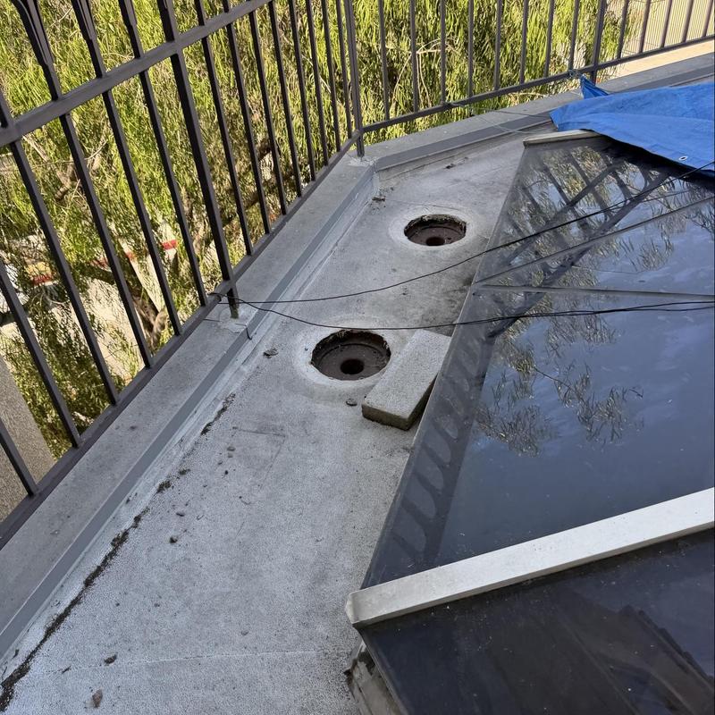 Skylight flashing and roof drain inspection area Skylight flashing and roof drain inspection area