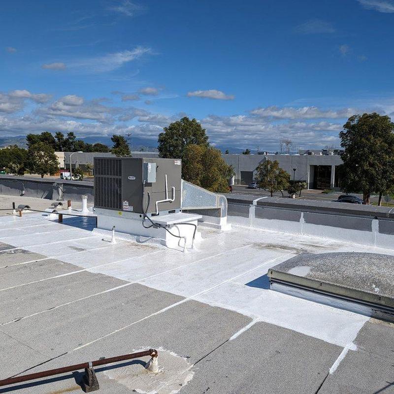 Commercial rooftop HVAC unit and sealed roofing membrane Commercial rooftop HVAC unit and sealed roofing membrane