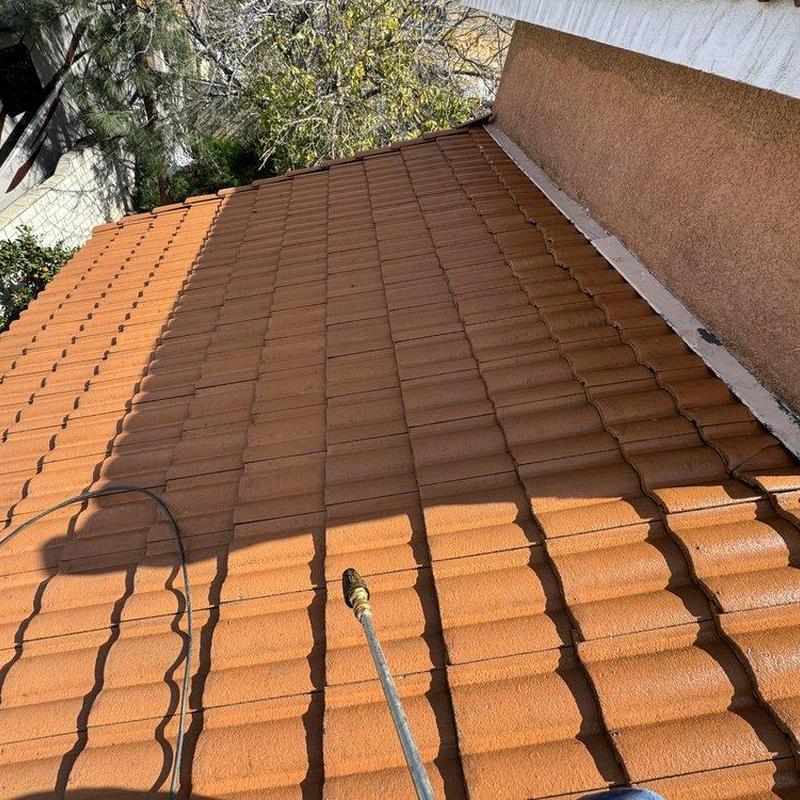 Tile roof with cleaning equipment on residential house Tile roof with cleaning equipment on residential house