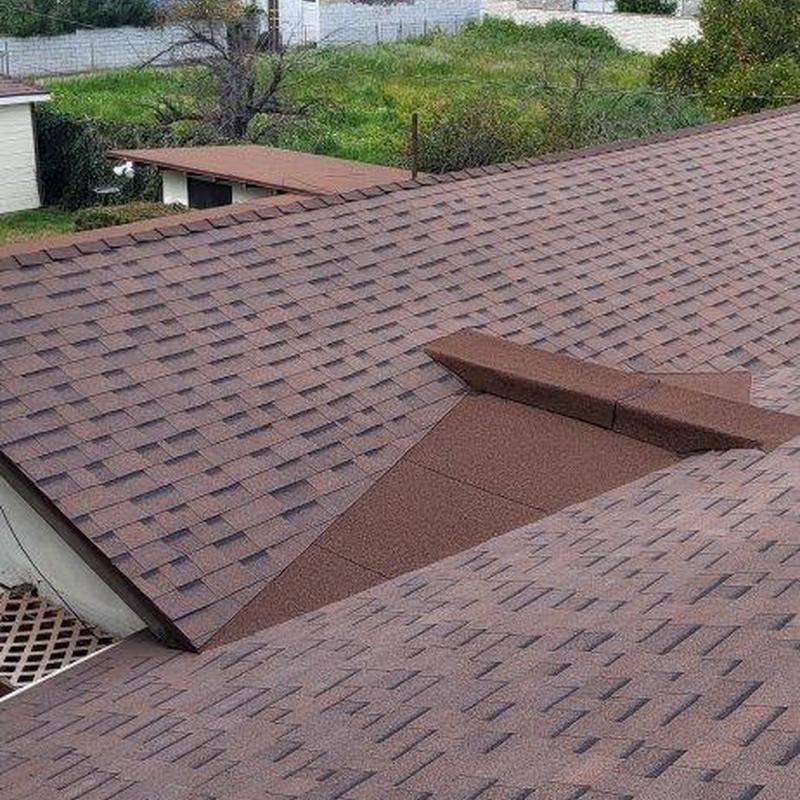 Shingle roof with vent flashing on residential building Shingle roof with vent flashing on residential building