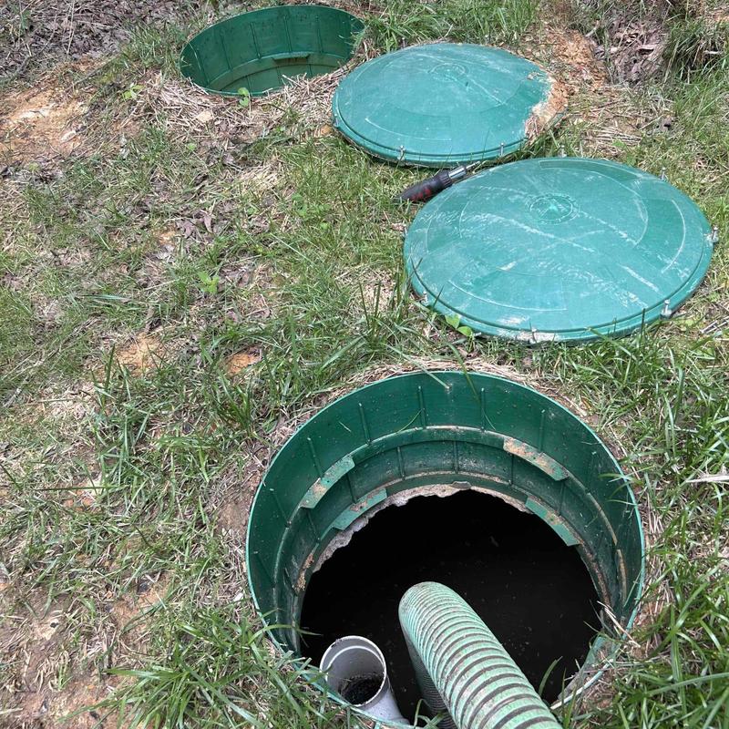 Septic tank lids with hose pumping at residential site