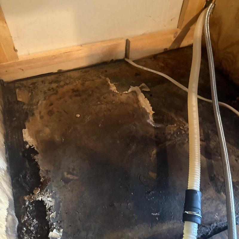 Water heater drain pan with severe corrosion damage