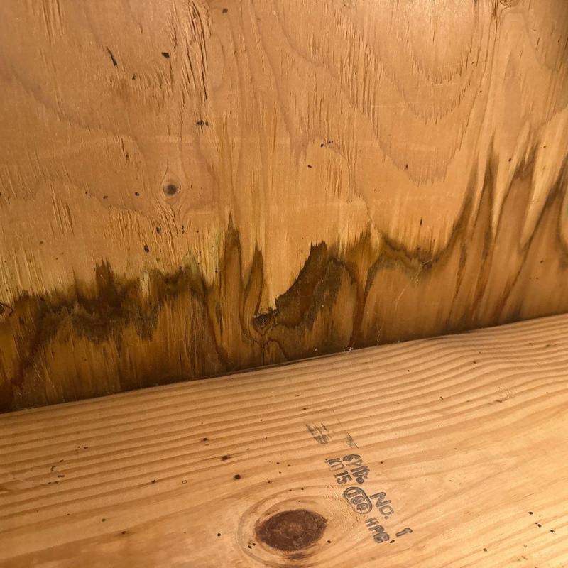 Roof sheathing with water damage stains