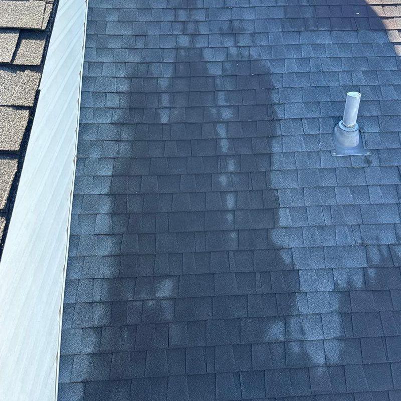 Asphalt shingles with hail damage and vent flashing