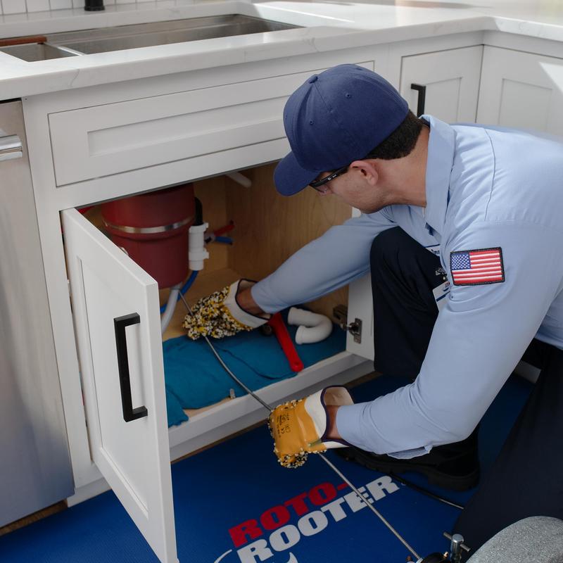 Garbage disposal and kitchen sink drain cleaning under cabinet Garbage disposal and kitchen sink drain cleaning under cabinet