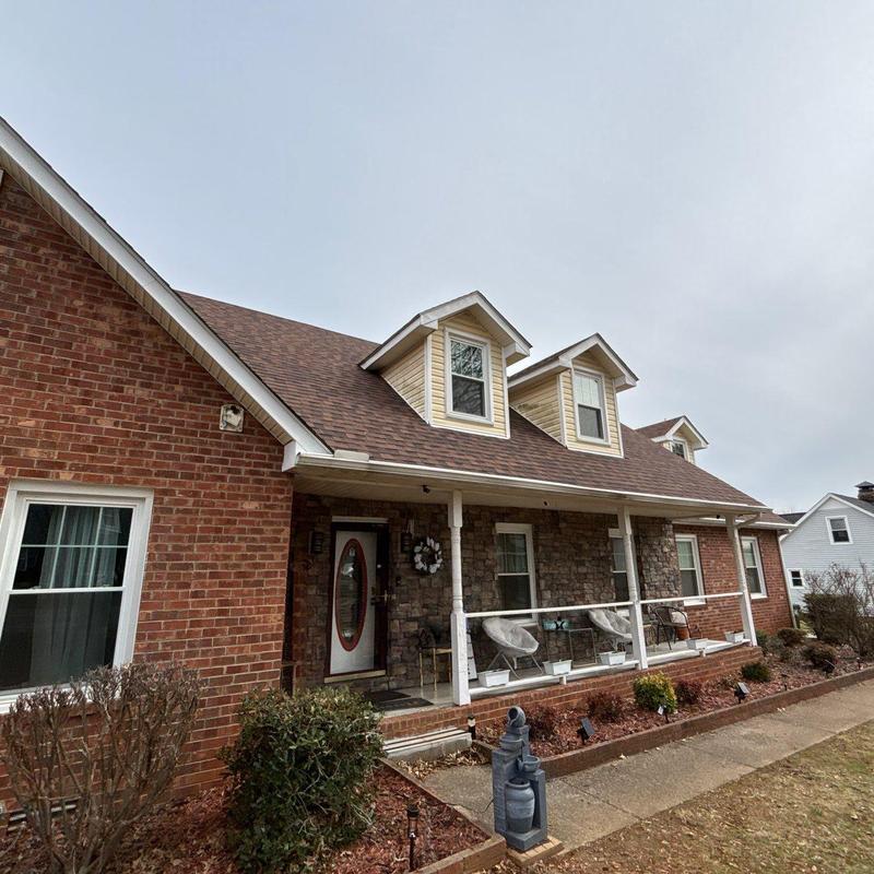 Asphalt shingle roof with hail damage inspection