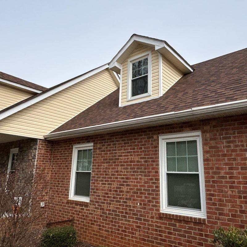 Asphalt shingle roofing with dormer and gutters