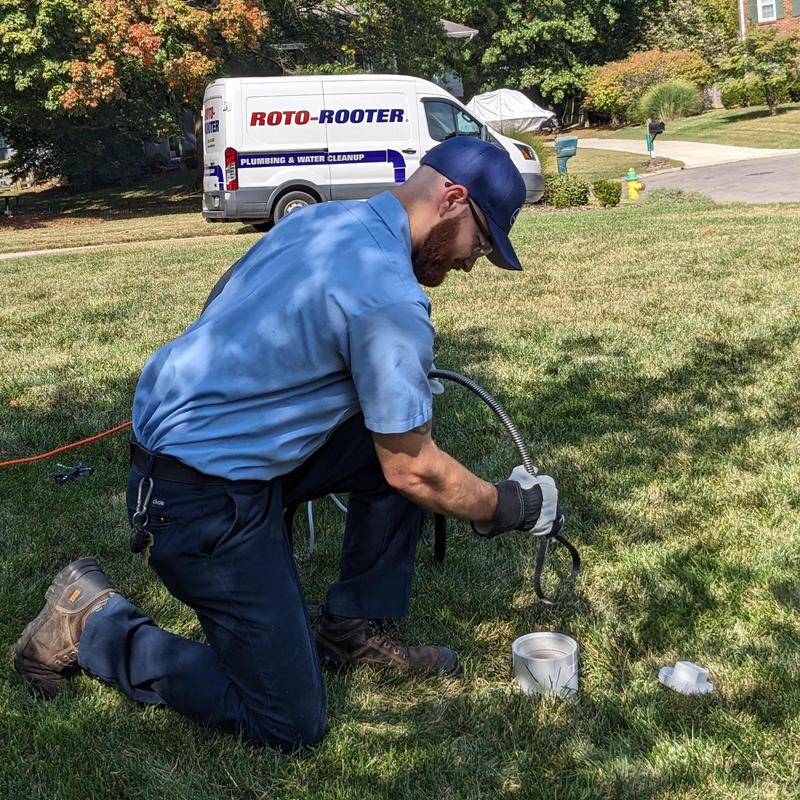 Main drain line clearing with cable in grass lawn