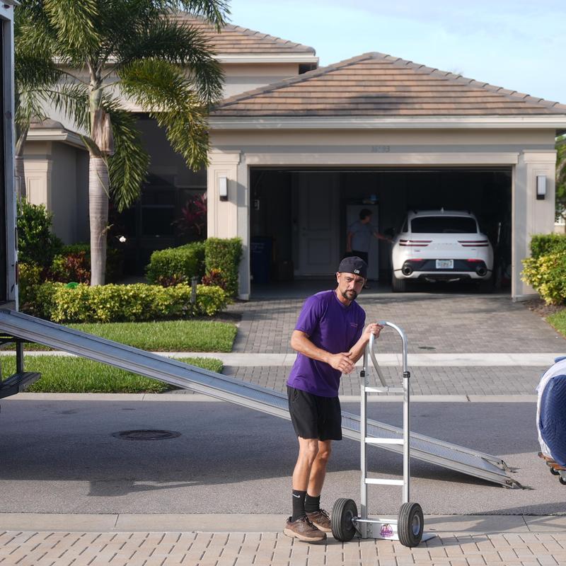 Dolly cart beside ramp for local home move Dolly cart beside ramp for local home move