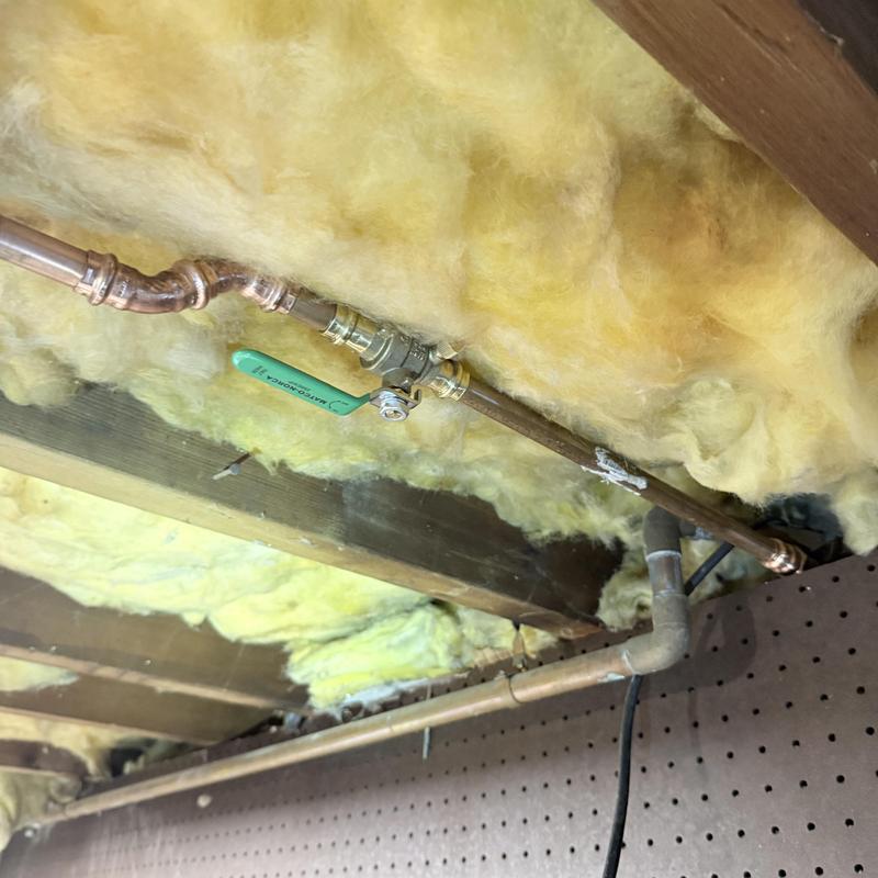 Copper water supply pipe with new ball valve installed