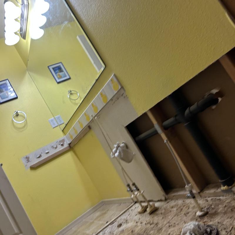 Bathroom plumbing rough-in with exposed pipes and wall removal Bathroom plumbing rough-in with exposed pipes and wall removal