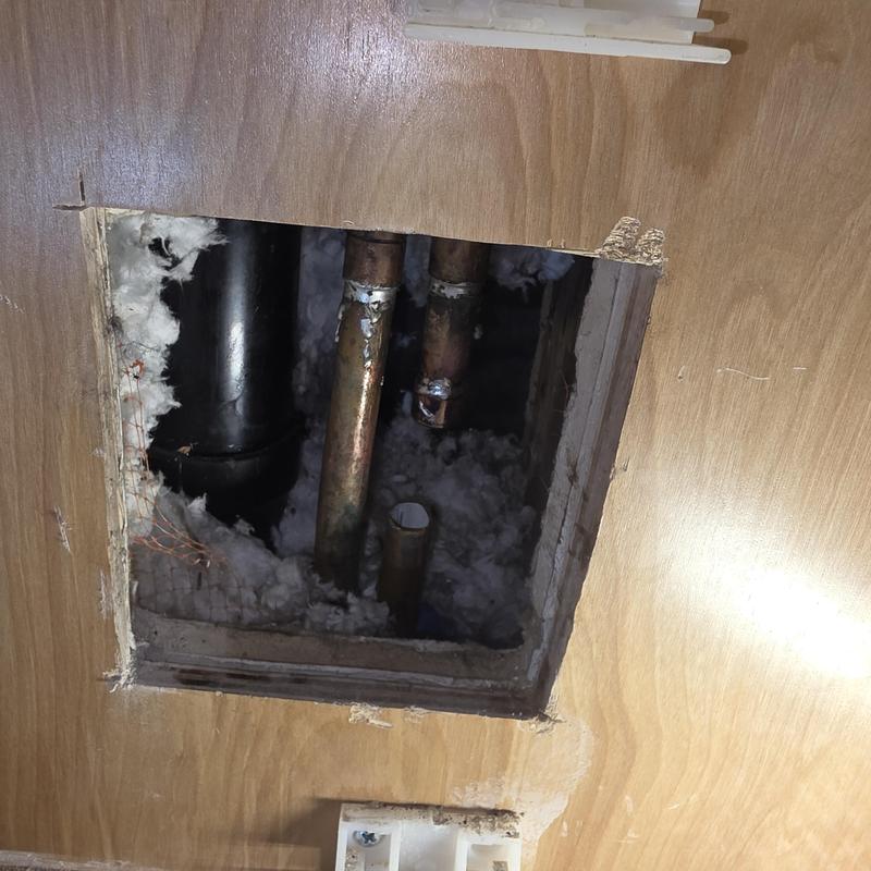 Copper cold water pipes inside wall access panel Copper cold water pipes inside wall access panel