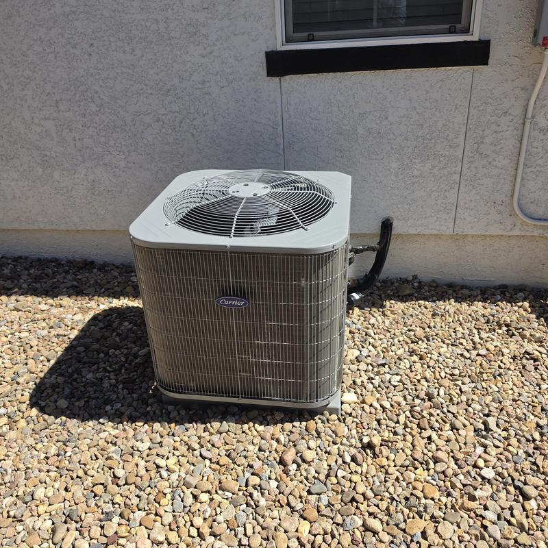 Carrier air conditioner unit outside residential home Carrier air conditioner unit outside residential home