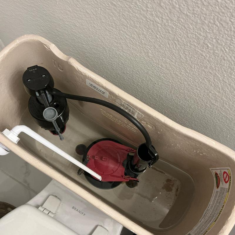 Toilet fill valve and flush valve inside tank