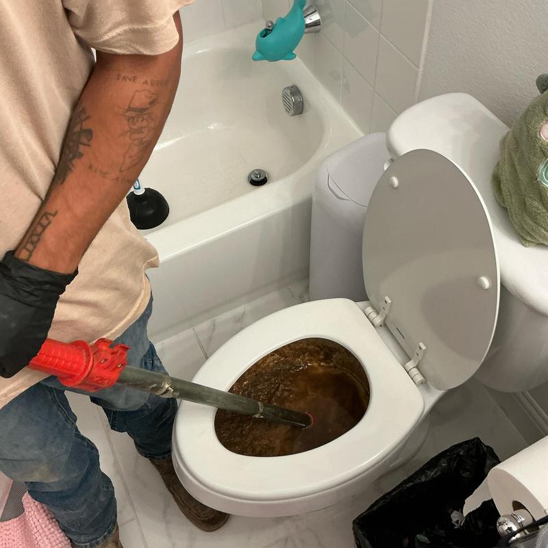 Toilet auger clearing heavy paper blockage