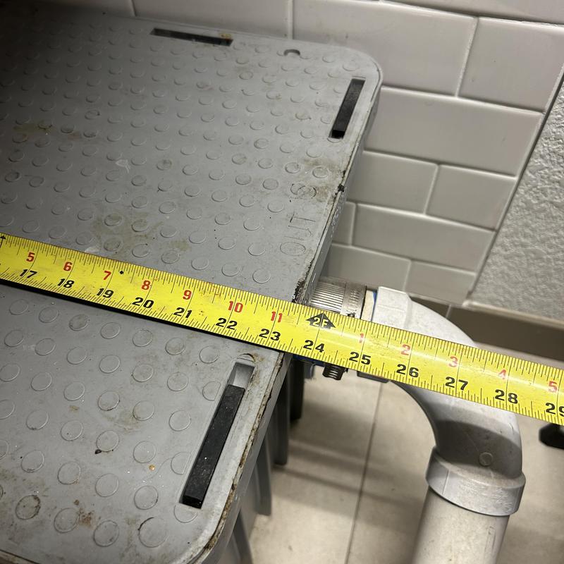 Plastic grease trap with measuring tape across edge Plastic grease trap with measuring tape across edge