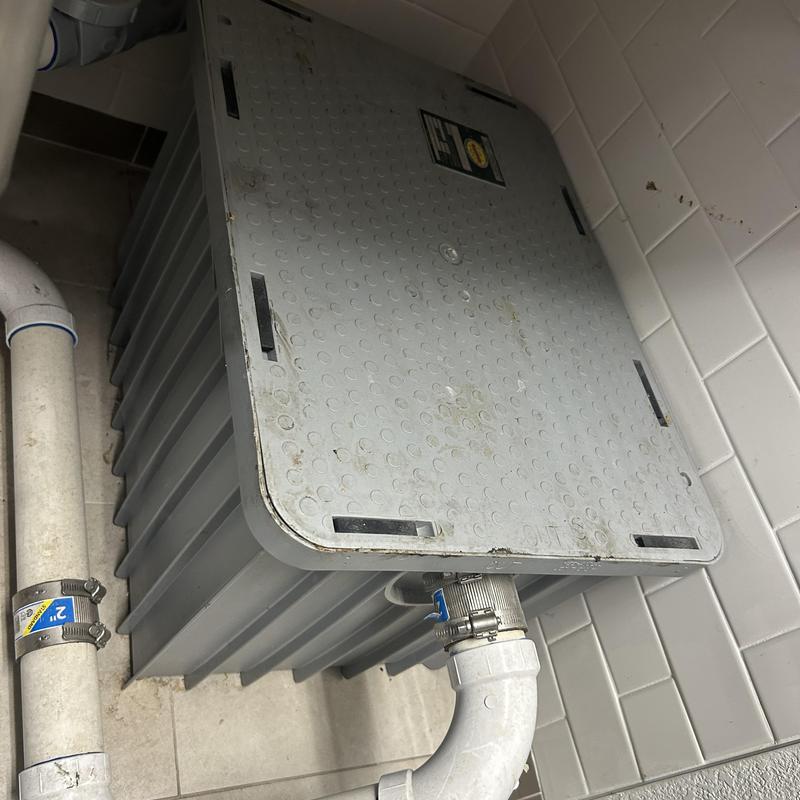 Plastic grease trap under sink with plumbing connections Plastic grease trap under sink with plumbing connections