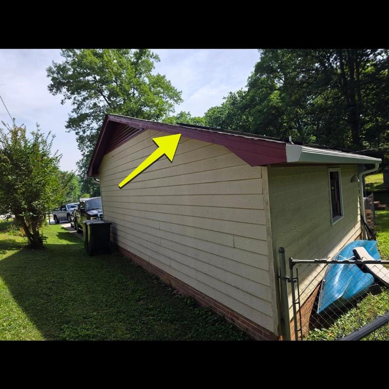 Roof edge trim inspection with yellow arrow mark