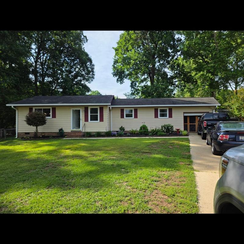 Roof with existing solar panel system in Simpsonville, SC