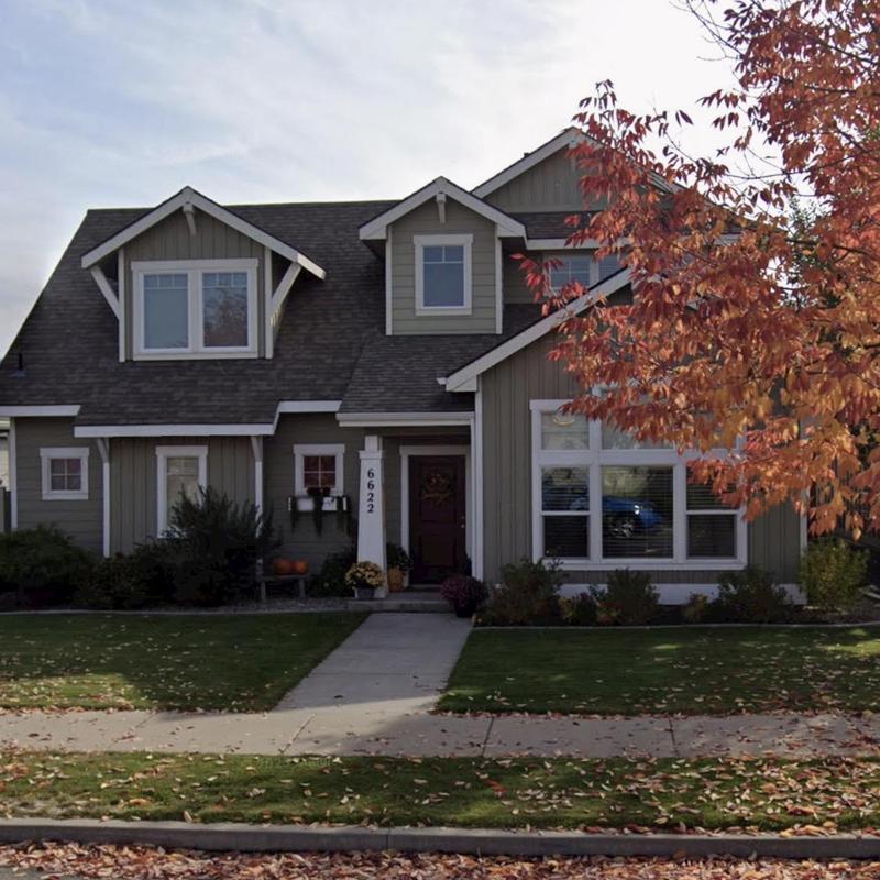 Asphalt shingle roof with dormers on residential house Asphalt shingle roof with dormers on residential house