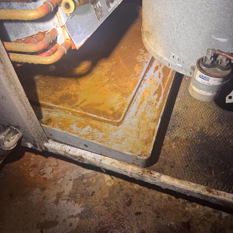 Heat pump rusted drip pan inside unit maintenance